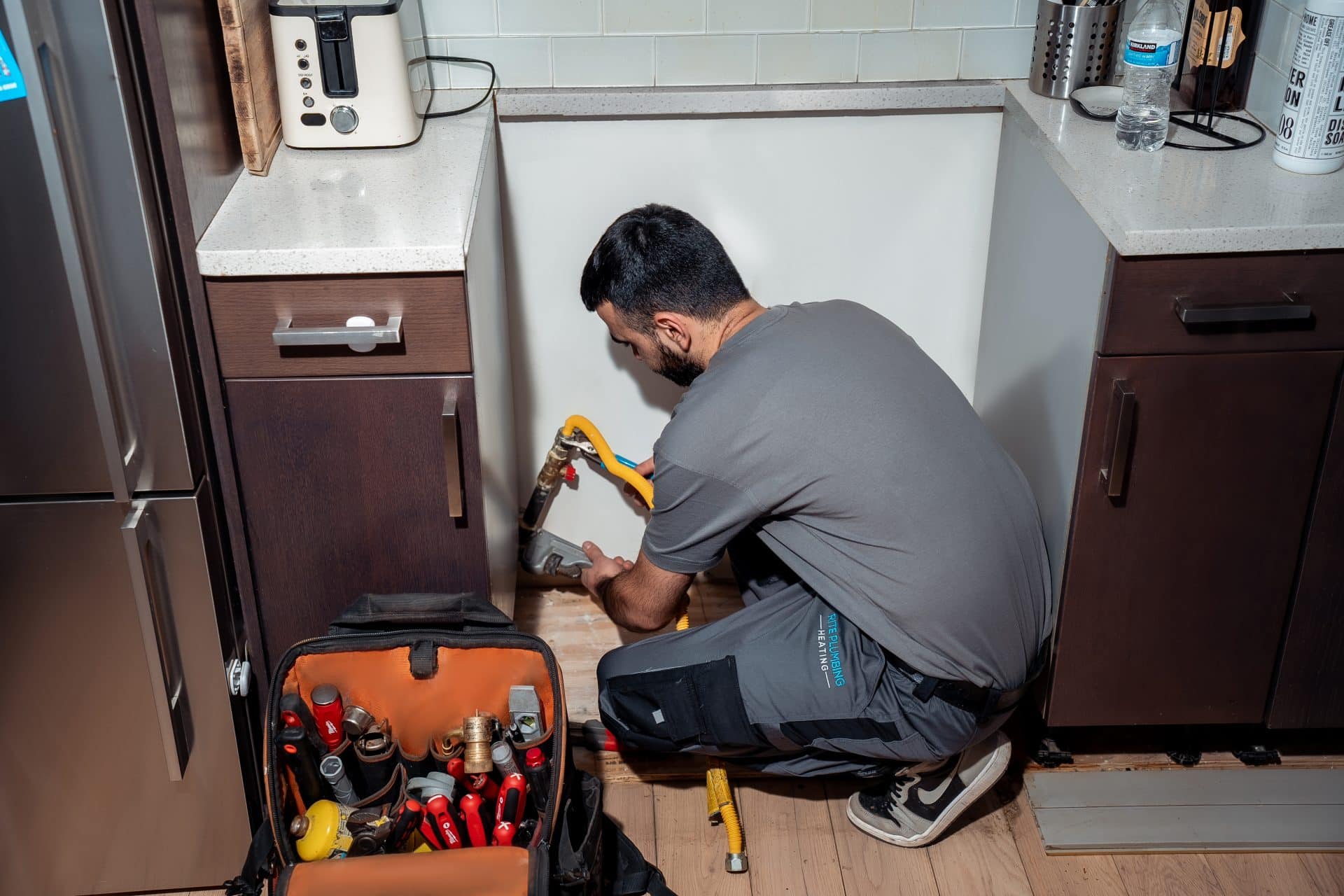 AquaStop plumber inspecting a residential plumbing connection