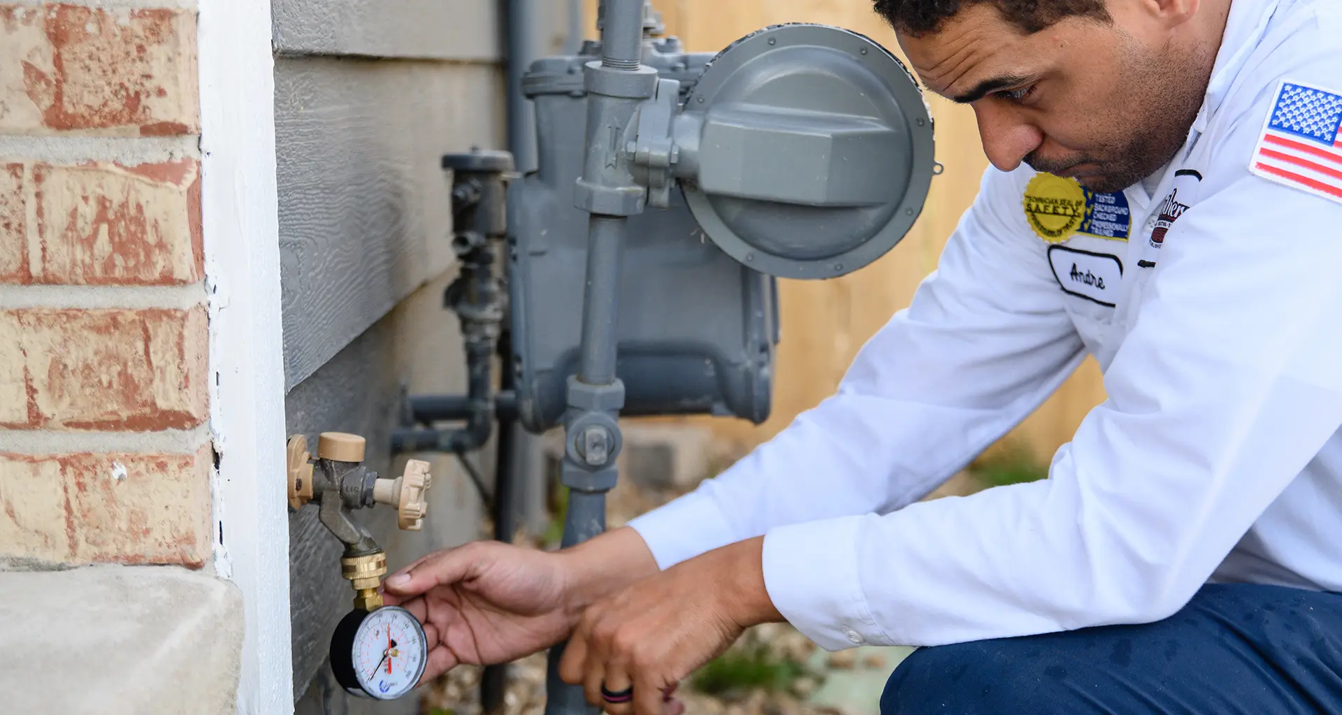 Plumbing professional working on a household fixture