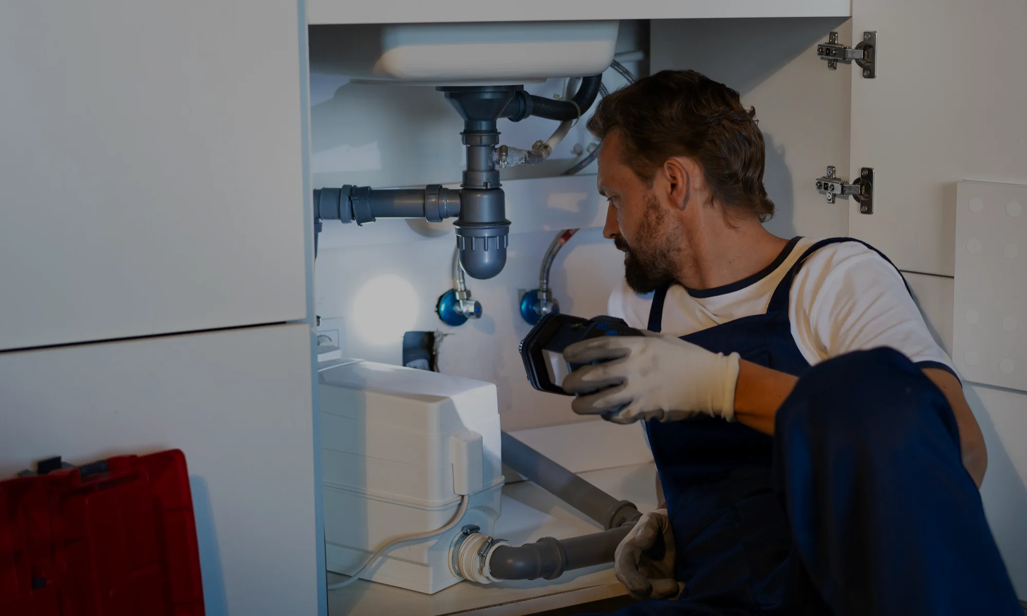 Plumbing professional servicing a commercial property